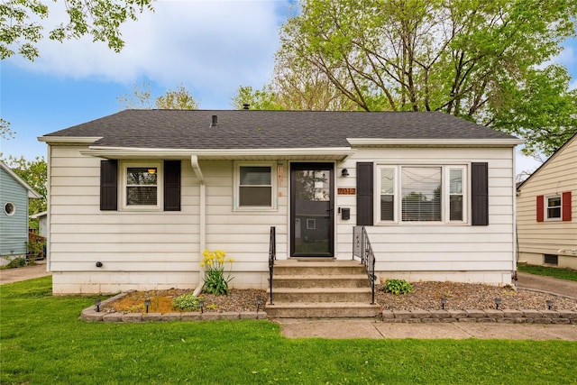2012 61st St, Des Moines, IA 50322 - view of front of property featuring a front yard and roof with shingles