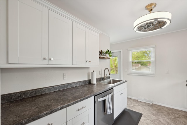 2012 61st St, Des Moines, IA 50322 - kitchen featuring a sink, stainless steel dishwasher, ornamental molding, white cabinets, and dark countertops