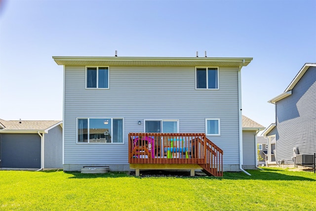 1001 Willow Valley Dr, Norwalk, IA 50211 - rear view of house featuring a wooden deck, a lawn, and central AC