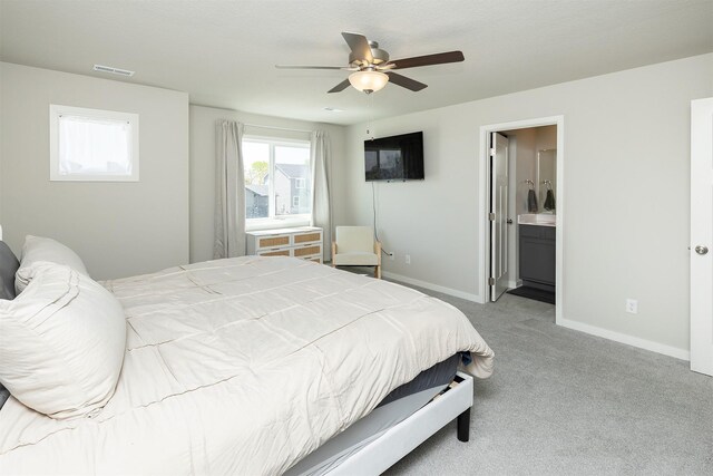 1001 Willow Valley Dr, Norwalk, IA 50211 - bedroom with carpet, baseboards, a ceiling fan, and ensuite bathroom