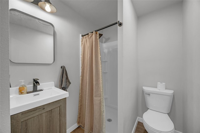full bath with wood finished floors, toilet, and a shower stall