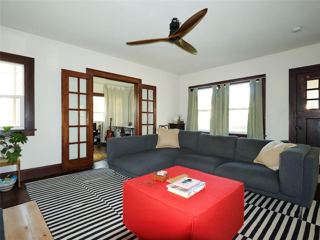 1321 Clark St, Des Moines, IA 50314 - living room with plenty of natural light, ceiling fan, wood finished floors, and french doors