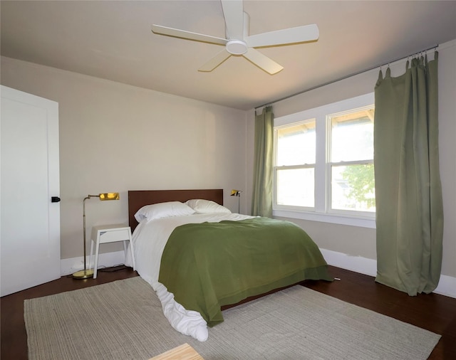 1321 Clark St, Des Moines, IA 50314 - bedroom with a ceiling fan and wood finished floors