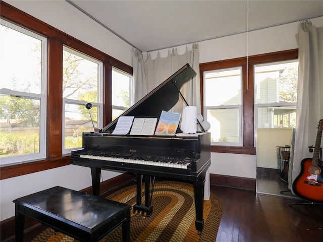 1321 Clark St, Des Moines, IA 50314 - sitting room featuring healthy amount of natural light, wood-type flooring, and baseboards
