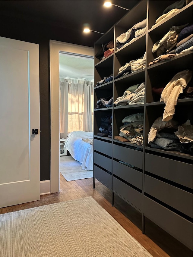 1321 Clark St, Des Moines, IA 50314 - walk in closet with wood finished floors