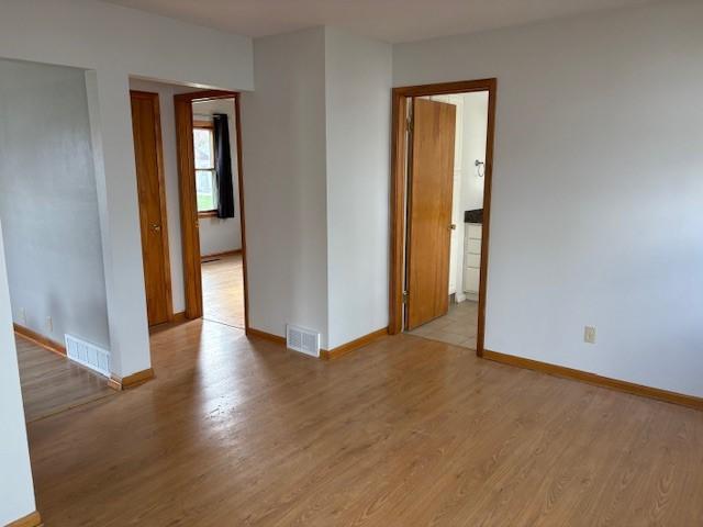 1604 Elder Dr, Marshalltown, IA 50158 - unfurnished room with light wood-style flooring and baseboards