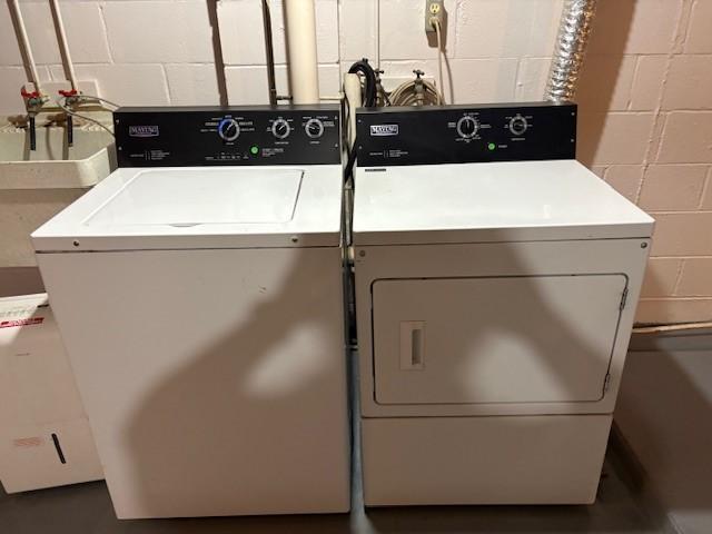 1604 Elder Dr, Marshalltown, IA 50158 - washroom with separate washer and dryer and concrete block wall