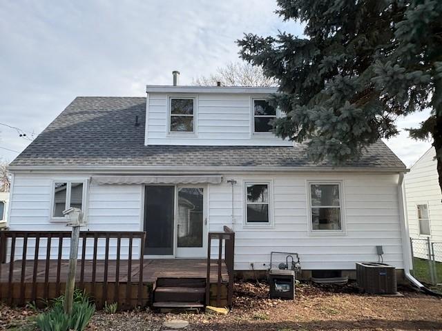 1604 Elder Dr, Marshalltown, IA 50158 - back of house featuring central AC unit, a deck, and roof with shingles