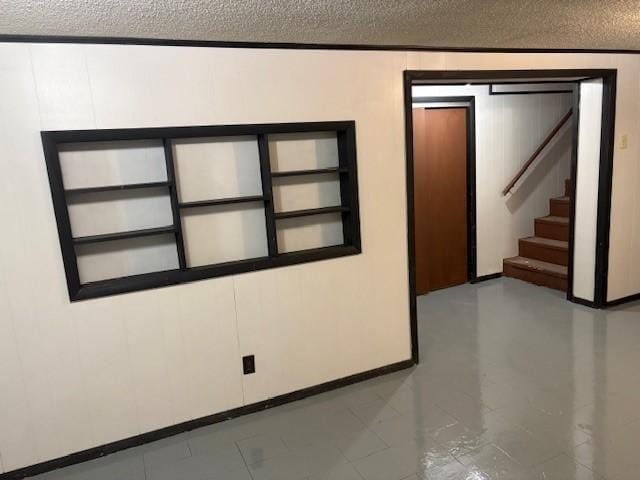 1604 Elder Dr, Marshalltown, IA 50158 - unfurnished room with a textured ceiling and stairs
