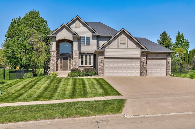 view of front of home featuring concrete driveway, an attached garage, and stone siding