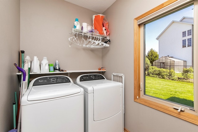 laundry area with independent washer and dryer
