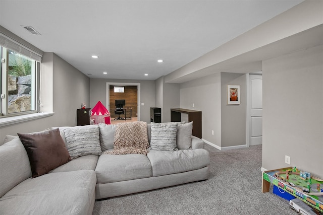 carpeted living room featuring recessed lighting and baseboards