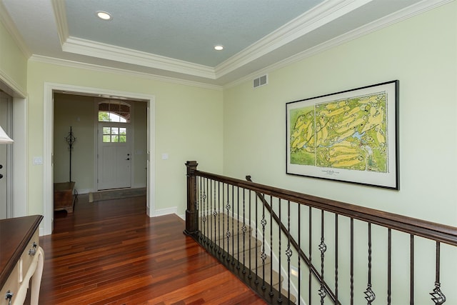 1914 Park Ave, Des Moines, IA 50315 - corridor featuring wood finished floors, an upstairs landing, ornamental molding, a raised ceiling, and baseboards