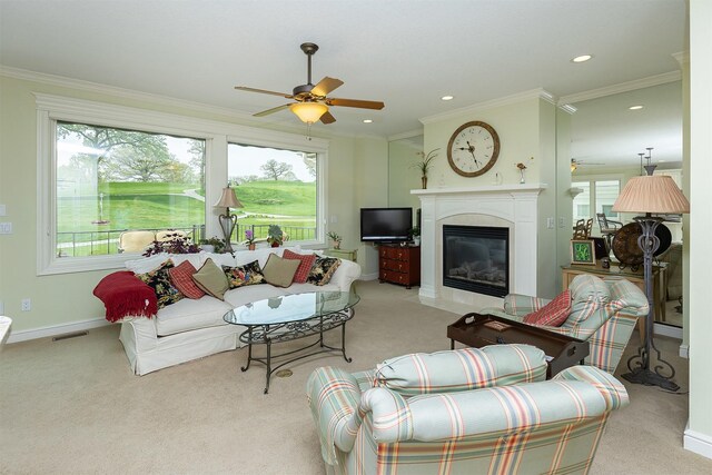 1914 Park Ave, Des Moines, IA 50315 - carpeted living room with a ceiling fan, a fireplace with flush hearth, recessed lighting, crown molding, and baseboards
