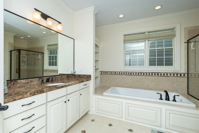 1914 Park Ave, Des Moines, IA 50315 - bathroom with a shower stall, vanity, a garden tub, crown molding, and recessed lighting