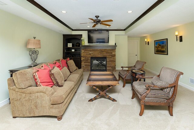 1914 Park Ave, Des Moines, IA 50315 - living room featuring a raised ceiling, a ceiling fan, crown molding, recessed lighting, and baseboards