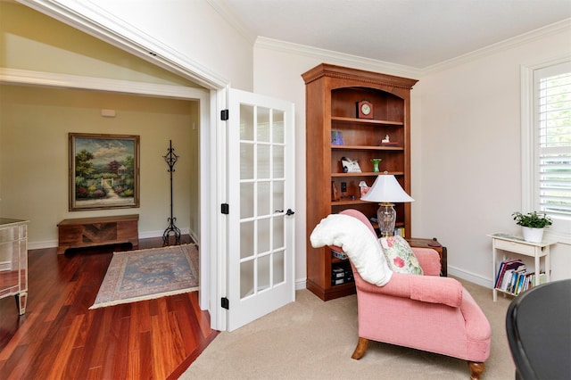 1914 Park Ave, Des Moines, IA 50315 - sitting room with wood finished floors and crown molding