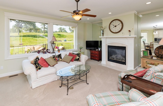 1914 Park Ave, Des Moines, IA 50315 - living area featuring light colored carpet, healthy amount of natural light, a fireplace, a ceiling fan, and recessed lighting