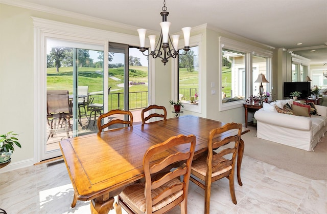 1914 Park Ave, Des Moines, IA 50315 - dining space featuring a chandelier and crown molding