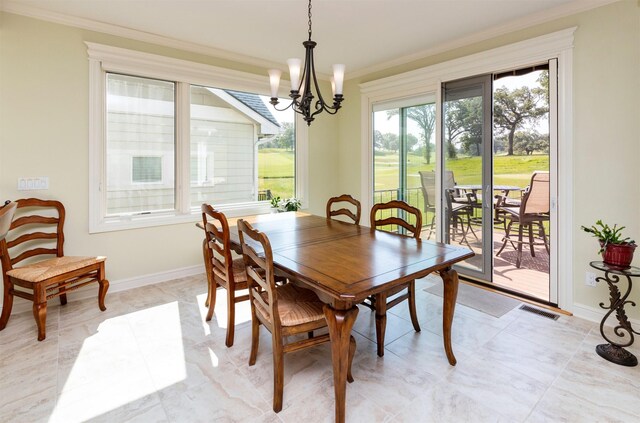 1914 Park Ave, Des Moines, IA 50315 - dining space featuring a chandelier and crown molding