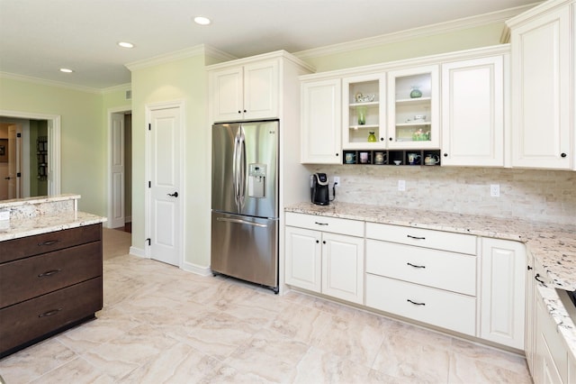 1914 Park Ave, Des Moines, IA 50315 - kitchen featuring stainless steel fridge, tasteful backsplash, dark brown cabinets, recessed lighting, and ornamental molding