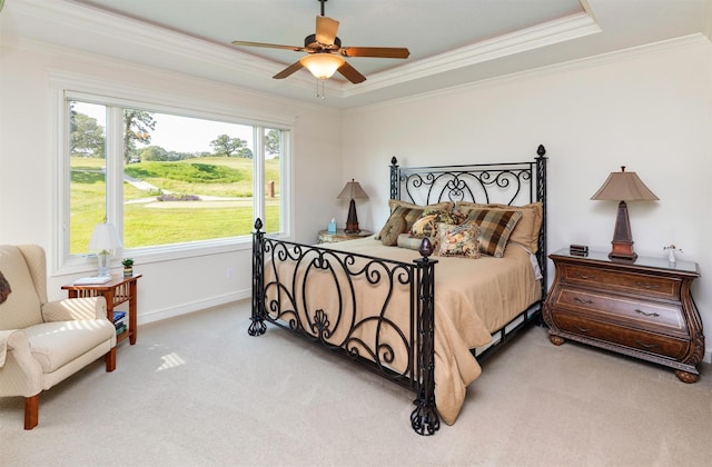 1914 Park Ave, Des Moines, IA 50315 - carpeted bedroom featuring crown molding, a raised ceiling, and ceiling fan