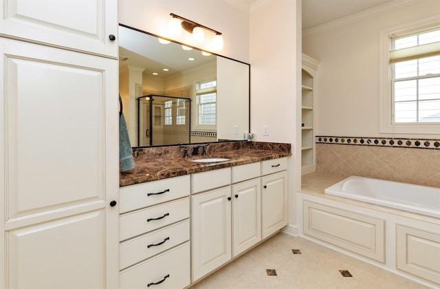 1914 Park Ave, Des Moines, IA 50315 - bathroom featuring a shower stall, vanity, a bath, tile patterned floors, and ornamental molding