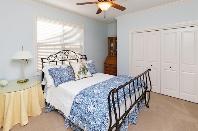 1914 Park Ave, Des Moines, IA 50315 - carpeted bedroom featuring ornamental molding, a closet, and ceiling fan