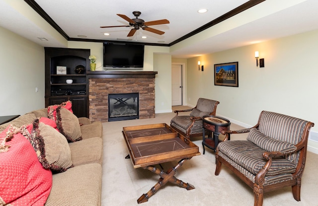 1914 Park Ave, Des Moines, IA 50315 - carpeted living room with ornamental molding, a ceiling fan, a stone fireplace, and recessed lighting