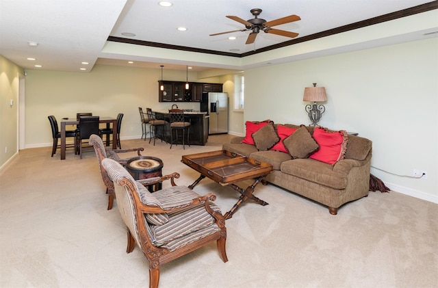 1914 Park Ave, Des Moines, IA 50315 - living room with light carpet, recessed lighting, crown molding, a ceiling fan, and a tray ceiling