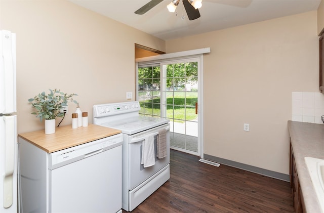 kitchen with white appliances, ceiling fan, dark wood-style flooring, light countertops, and baseboards