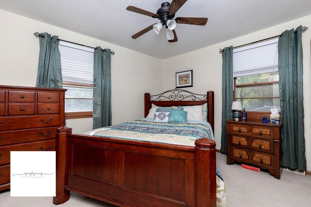 6404 Meredith Dr, Urbandale, IA 50322 - bedroom featuring light carpet and a ceiling fan