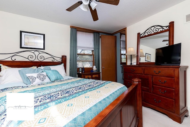 6404 Meredith Dr, Urbandale, IA 50322 - bedroom featuring light colored carpet, a textured ceiling, and ceiling fan