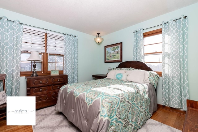 6404 Meredith Dr, Urbandale, IA 50322 - bedroom featuring wood finished floors