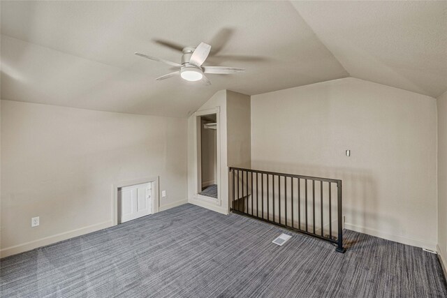 504 9th St, West Des Moines, IA 50265 - additional living space featuring vaulted ceiling, ceiling fan, carpet, and baseboards