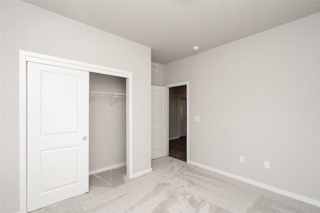 312 SW 17th St, Ankeny, IA 50023 - unfurnished bedroom featuring light carpet, baseboards, and a closet