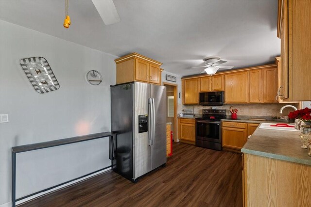 515 Kingman Blvd, Madrid, IA 50156 - kitchen with stainless steel appliances, a sink, a ceiling fan, dark wood-style floors, and tasteful backsplash
