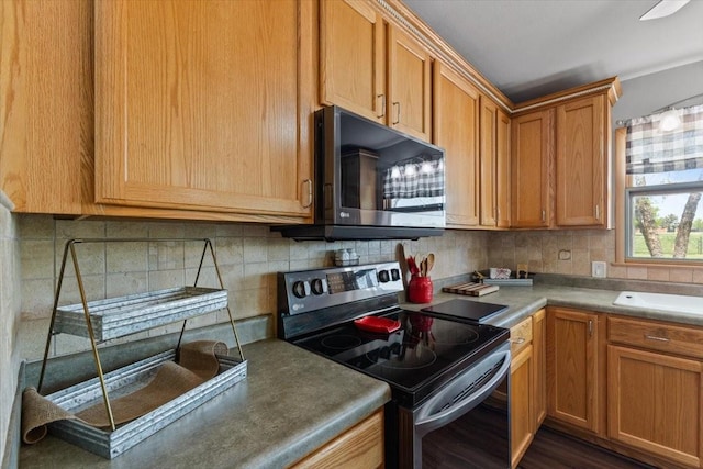 515 Kingman Blvd, Madrid, IA 50156 - kitchen featuring electric stove, backsplash, and brown cabinets