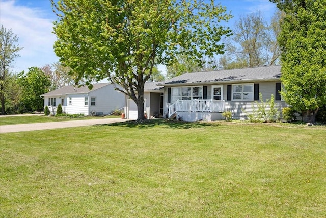 515 Kingman Blvd, Madrid, IA 50156 - ranch-style home with a garage, driveway, a front lawn, and covered porch