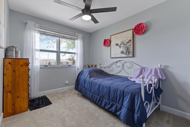 515 Kingman Blvd, Madrid, IA 50156 - carpeted bedroom with baseboards and a ceiling fan