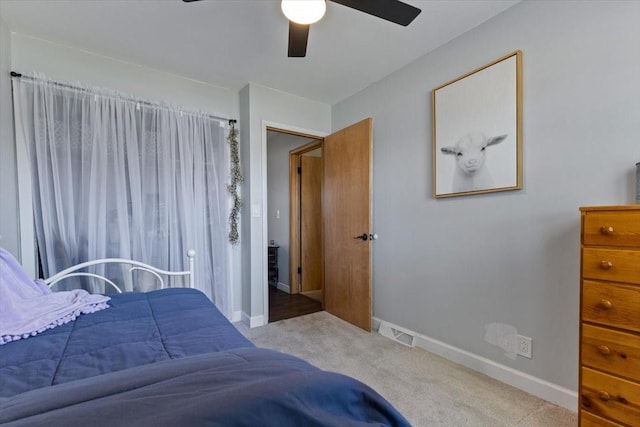515 Kingman Blvd, Madrid, IA 50156 - bedroom featuring carpet floors, baseboards, and ceiling fan
