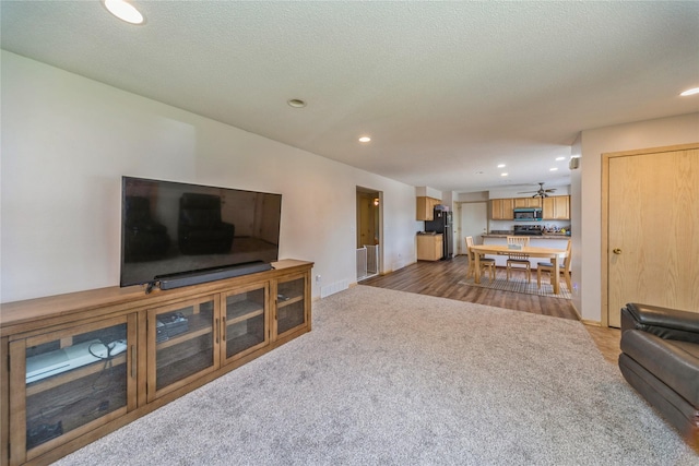 612 W Pleasant St, Pleasantville, IA 50225 - living room featuring carpet, recessed lighting, ceiling fan, and baseboards
