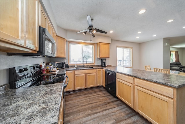 612 W Pleasant St, Pleasantville, IA 50225 - kitchen with dishwasher, a sink, a peninsula, electric range, and light brown cabinets