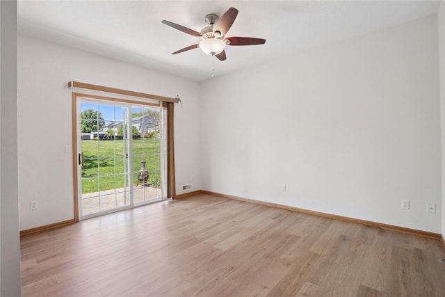 unfurnished room with light wood finished floors, a ceiling fan, and baseboards