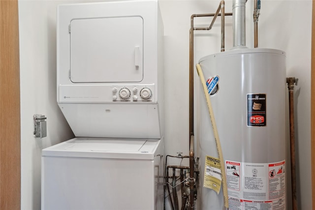 laundry area featuring stacked washer / dryer and gas water heater