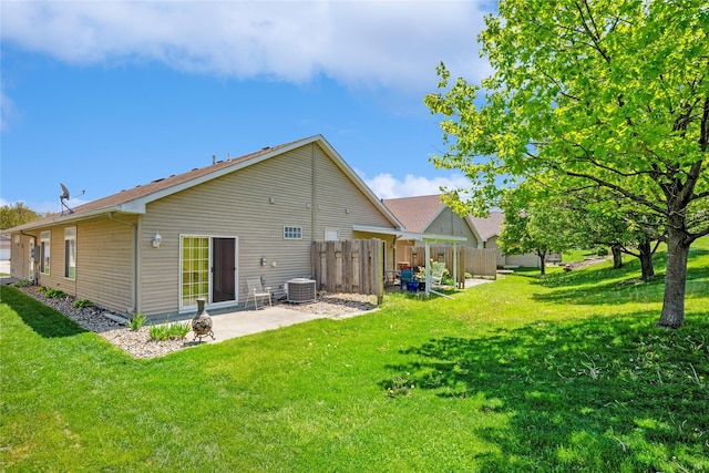 rear view of house featuring a patio area and central air condition unit