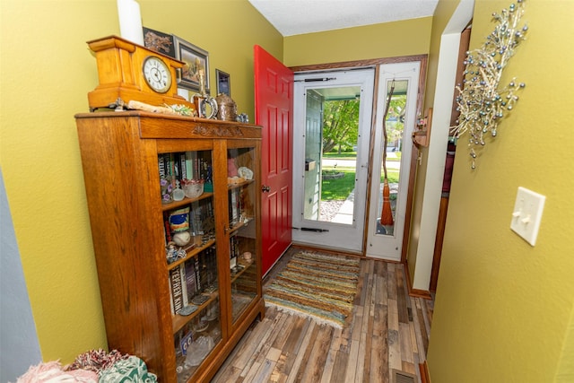 foyer featuring wood finished floors
