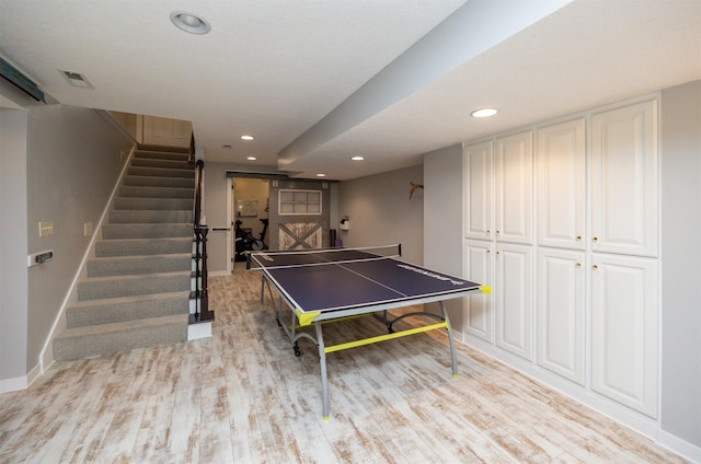 playroom with baseboards, recessed lighting, and light wood-style floors