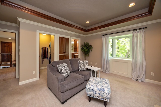 living room featuring light carpet, crown molding, a tray ceiling, baseboards, and recessed lighting