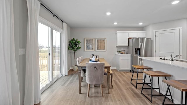 1415 Northview Dr, Waukee, IA 50263 - dining area featuring light wood-style floors and recessed lighting